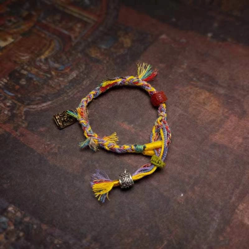 Artisans weave amulet bracelets