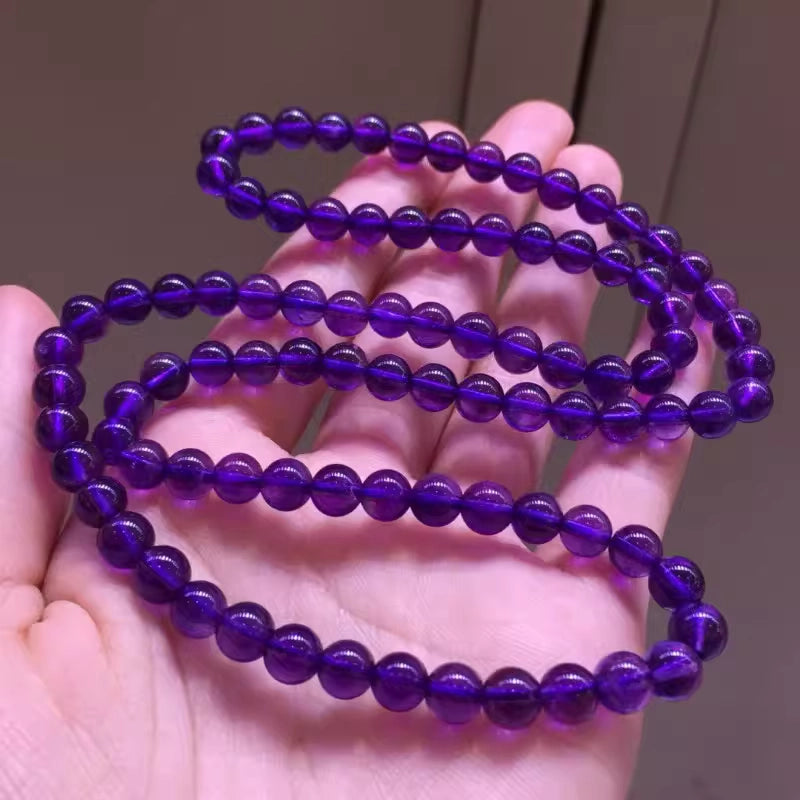 Layer up with this natural amethyst triple-wrap bracelet for a trendy look, and enjoy its vibes of wisdom and spiritual peace.