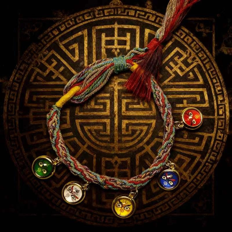 Close-up of the meticulous artisan knots and protective charms on the spiritual feng shui wealth bracelet.