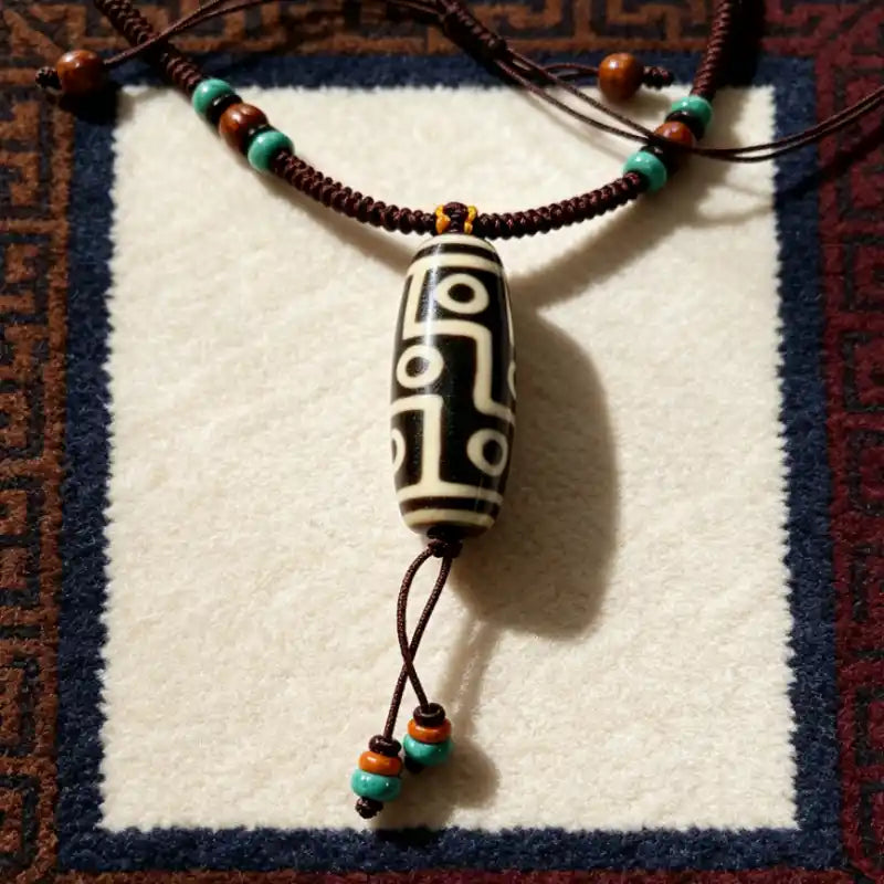 Himalayan spiritual necklace showing the Dzi Bead pendant and beaded tassels