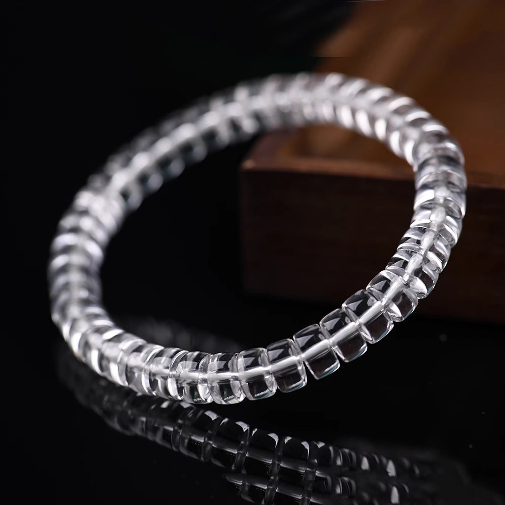 Close-up of hand polished natural clear quartz bracelet, negative energy cleansing spiritual quartz accessory