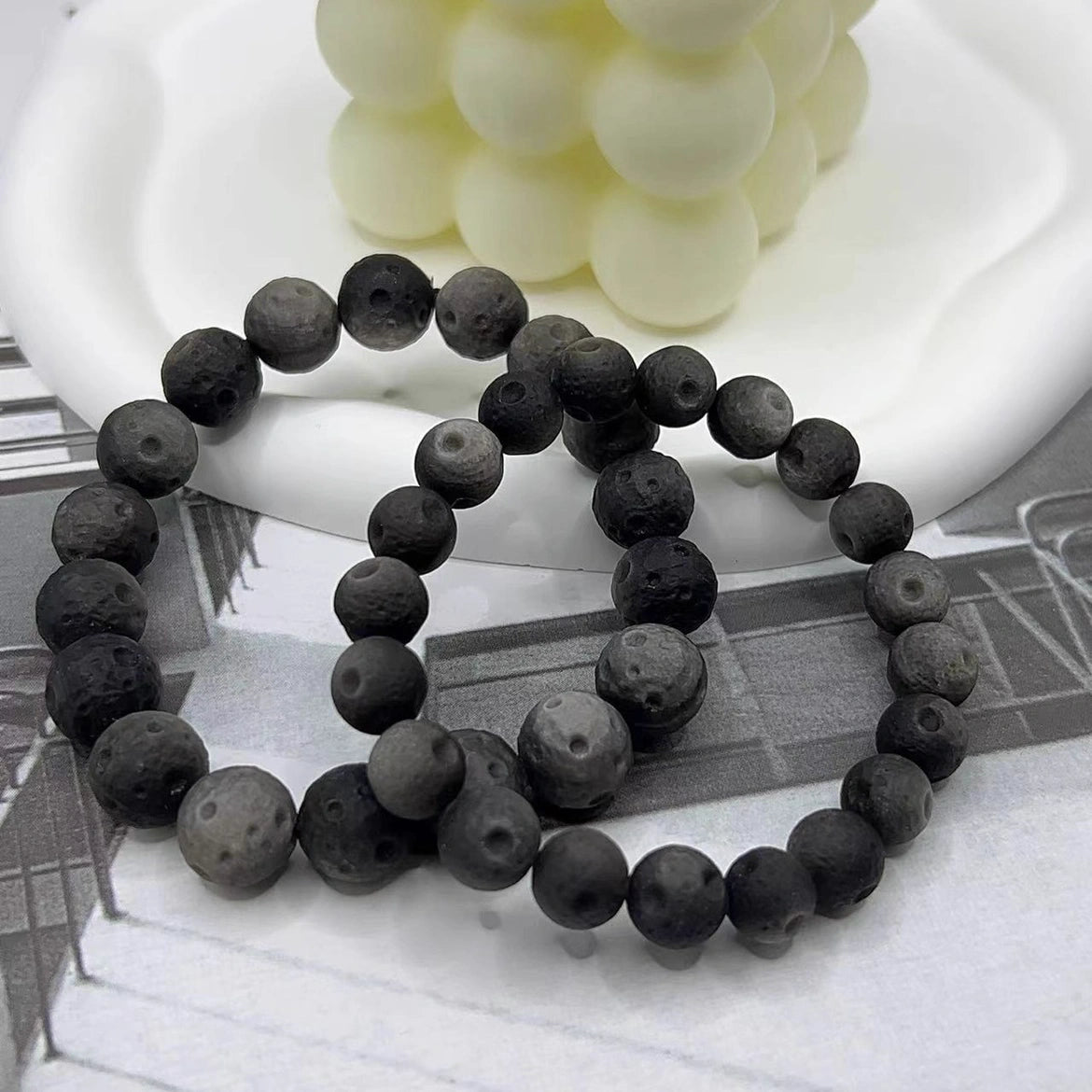 obsidian bead bracelets stacked display, natural black stone spiritual talisman for emotional healing daily wear