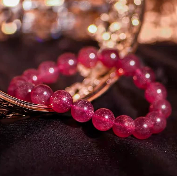 Worn spiritual healing strawberry quartz bracelet for daily mood adjustment