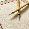 Thangka liner brush tips crossed, detail of fine weasel hair point