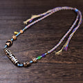 Full-length Tibetan dzi bead necklace with hand-braided cord and tassel ends