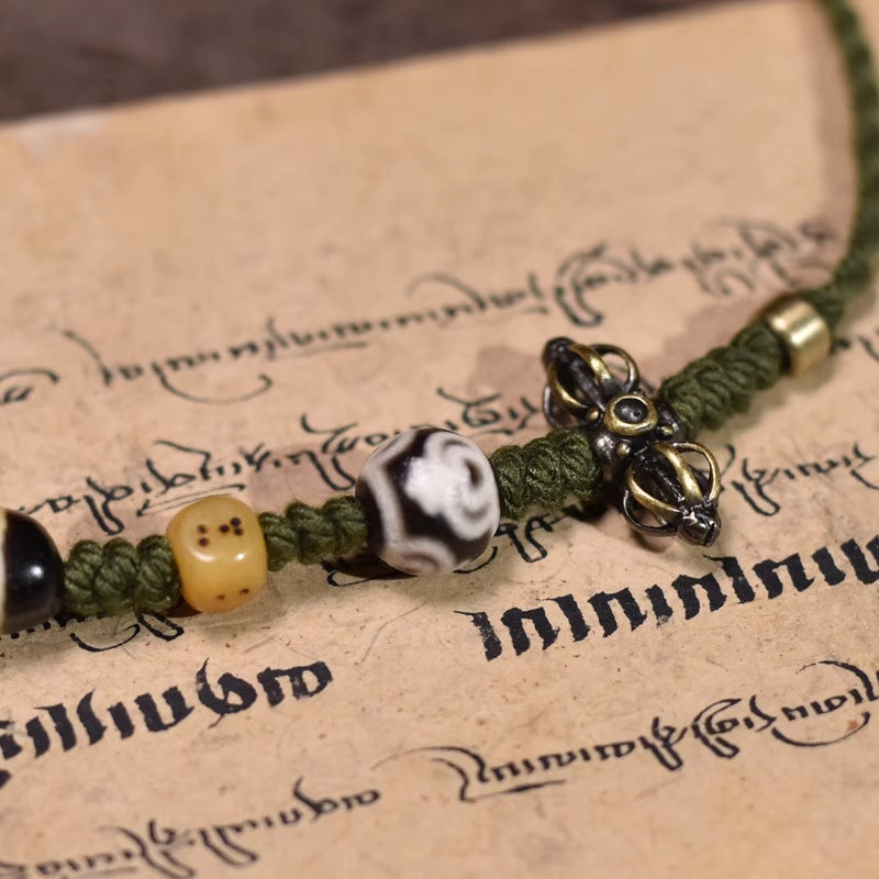 Ethnic woven cord necklace with vintage Tibetan dzi bead, handcrafted spiritual ornament