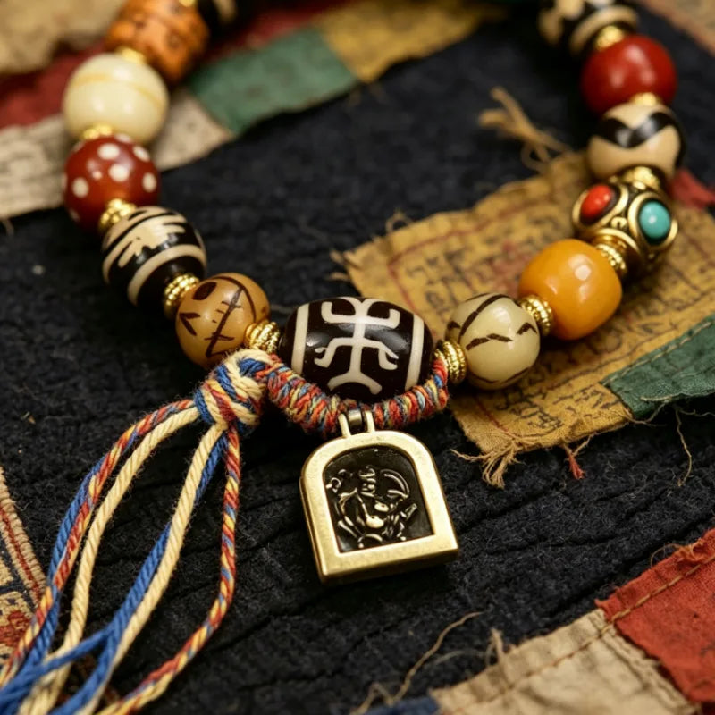 Tibetan Gau Box Amulet Charm Detail on Dzi Bead Bracelet with Silk Tassel