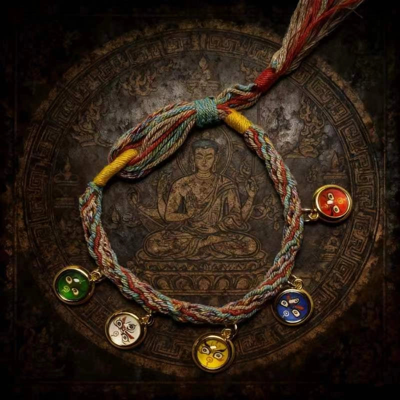 Hand-braided multicolor Tibetan protection bracelet featuring five gold-trimmed wealth deities charms on an authentic vintage background.