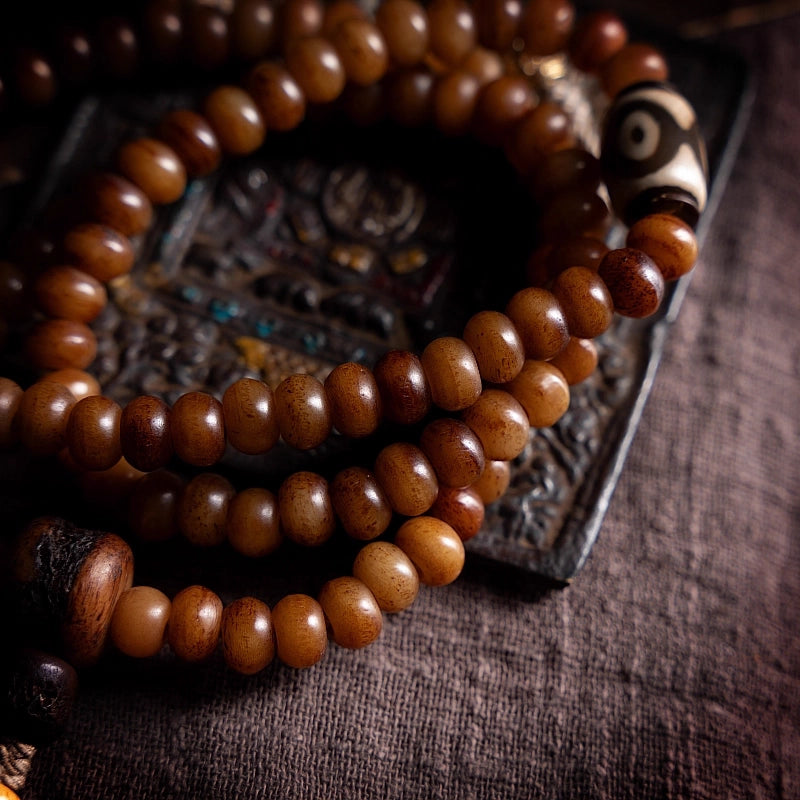  Flat lay of cypress smoked vintage Tibetan aged yak bone prayer bead mala bracelet