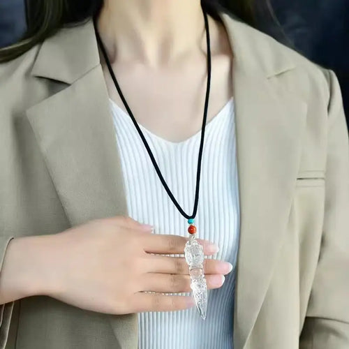 Model wearing clear quartz phurba pendant necklace, wearable meditation crystal jewelry
